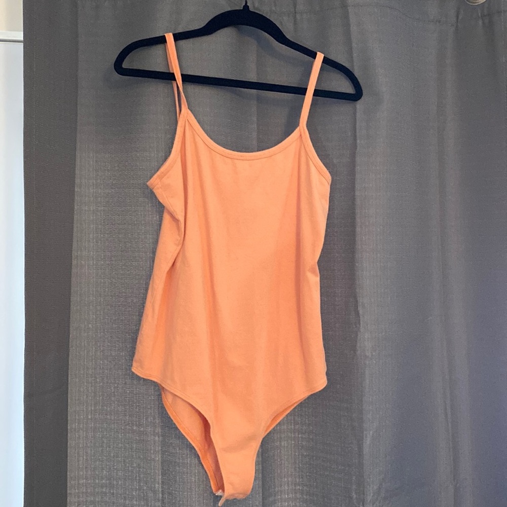 Body suit. Never seen worn, tags have been removed